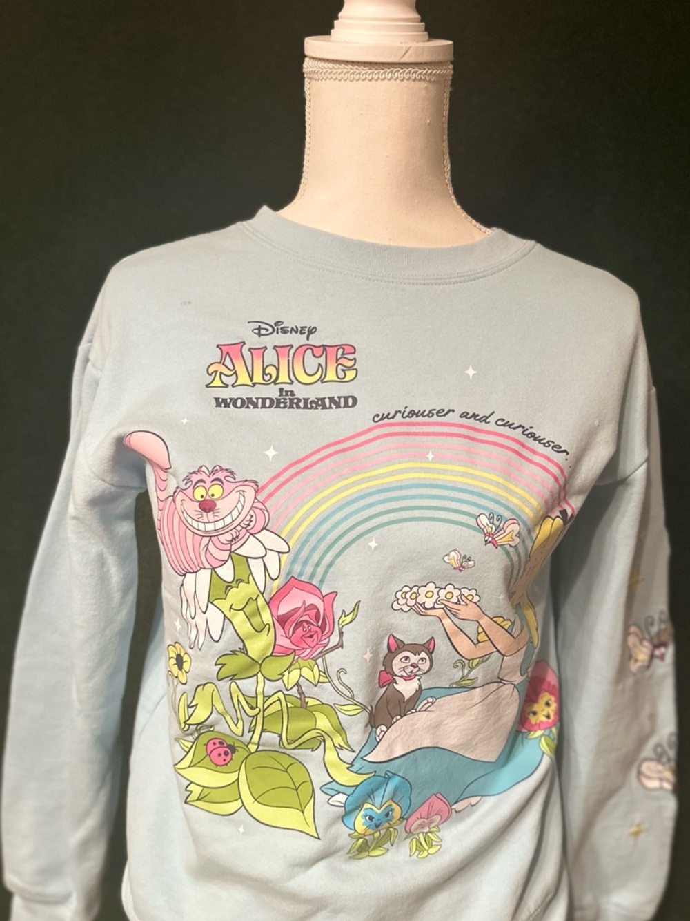 Disney Alice in Wonderland Light Blue Sweatshirt with Rainbow Graphic